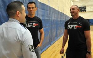 Mike Dolce and Rich Franklin speak to a soldier at McChord AFB